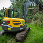 Reduced-swing excavator shows its steel in the Highlands