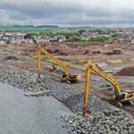 Heavy duty Cats help marine contractors ‘reach’ port goals Rock placement at Ardrossan North Shore site