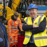 Scottish construction firms urged to pursue apprenticeship grants Graeme Dey MSP watching apprentices at work at the National Construction College, Inchinnan