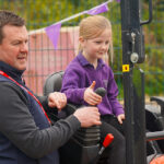 Firms help bring construction to life for Inverness pupils Child on micro digger