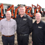 Streamlined HRN is gearing up for growth Three men standing in front of excavators