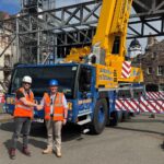 Bernard Hunter snaps up 150-tonne capacity Liebherr crane Two men shaking hands in front of crane