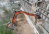 Develon digger takes key role in demolition of ex-Tesla site Demolition excavator dismantling building
