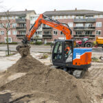 Electric digger charges ahead with town centre regeneration Compact electric excavator