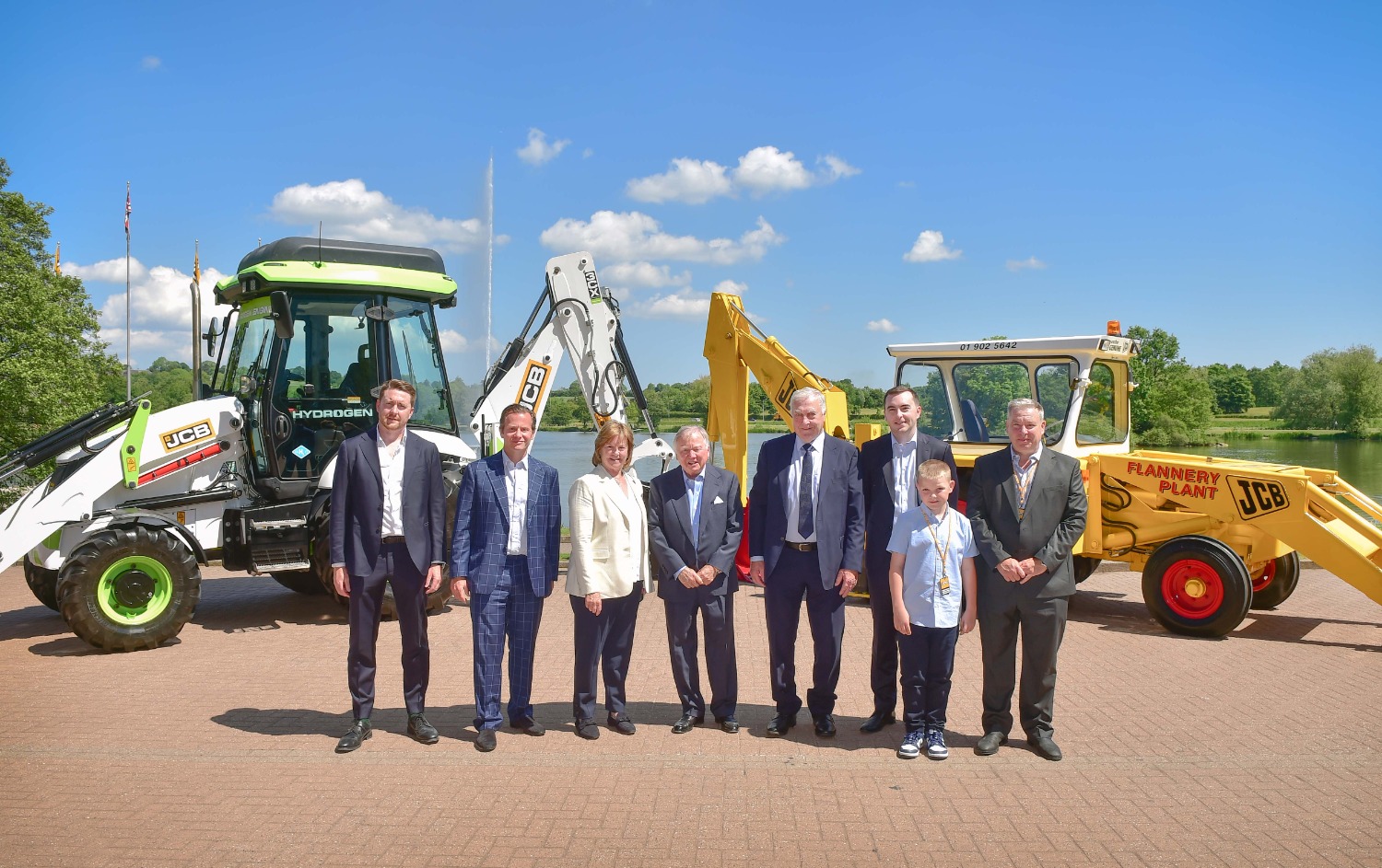 From left to right are: Flannery Plant Hire MD Patrick Flannery, George Bamford, Mary Flannery, JCB Chairman Anthony Bamford, Pat Flannery Snr, Paul Flannery, Thomas Flannery and Martin Flannery.