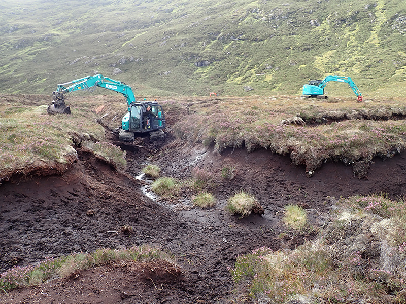 Excavator being utilised in peatland restoration work