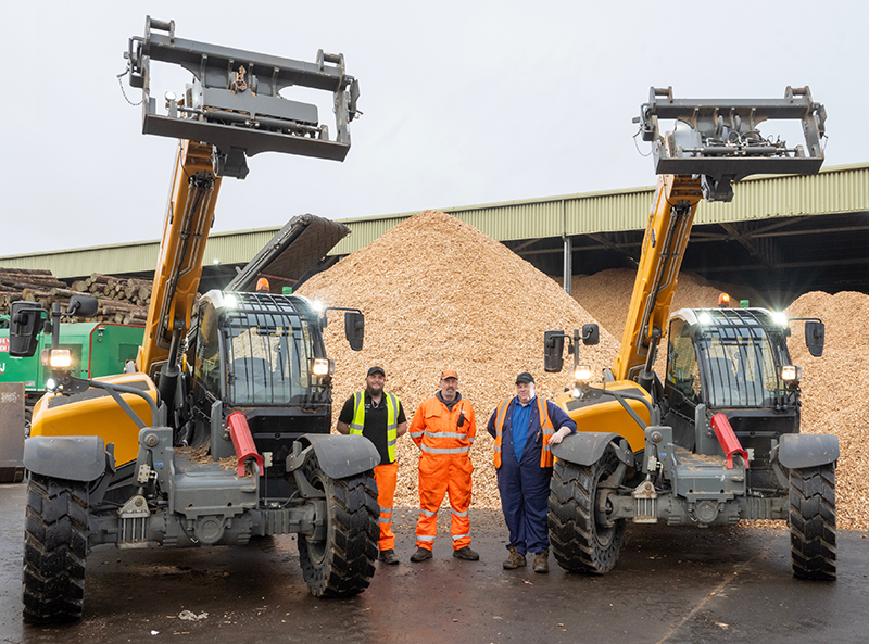 Telehandlers operating at recycling centre pictured alongside staff from the facility