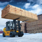 Hyundai launches new electric forklift range Electric forklift lifting lumber