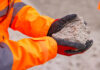 CDE webinar to focus on unlocking greater value from sand and aggregates Construction worker holding sand