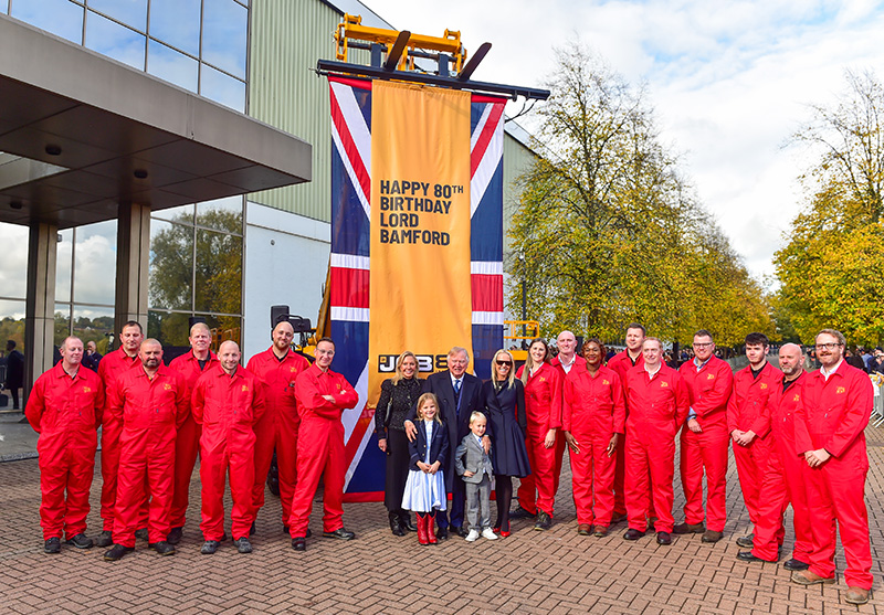 Lord Bamford joins the JCB demonstration team with his family