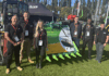 Miller UK and Flannery Plant Hire celebrate success of charity bucket auction Miller & Flannery team with charity bucket at PlantWorx