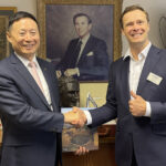 SANY welcomes new dealer to UK network Mr Ming XU (senior VP, SANY) and Alexander Scott (CEO of T H WHITE Group)