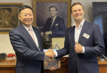 SANY welcomes new dealer to UK network Mr Ming XU (senior VP, SANY) and Alexander Scott (CEO of T H WHITE Group)