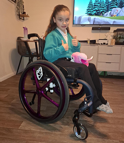 Isabelle Butlin in her new purple wheelchair