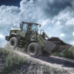 JCB to supply US military with 535 machines Militarised vehicle on dirt hill
