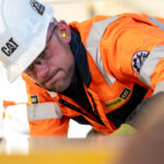 Finning engineer heads for America to compete in global final of Caterpillar technician challenge Field service engineer working on construction equipment