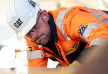 Finning engineer heads for America to compete in global final of Caterpillar technician challenge Field service engineer working on construction equipment