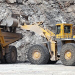 Falling demand for mineral products ‘threatens jobs and capacity’ Mineral products being loaded into construction equipment