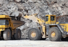Falling demand for mineral products ‘threatens jobs and capacity’ Mineral products being loaded into construction equipment