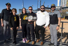 Finning field service engineer triumphs in global skills challenge Tom March with his award in Las Vegas