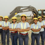 Volvo expands Iron Women initiative to address global skills shortages Female plant operators standing in front of Volvo excavator