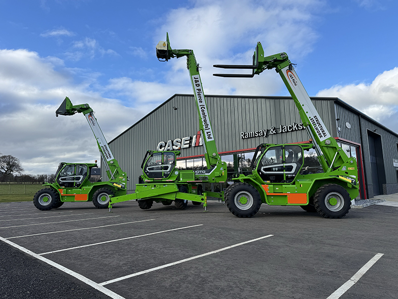 Telehandlers lined up in a yard