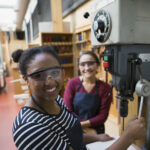 CITB aims to continue upward trend of women completing construction apprenticeships Portrait confident female high school students using drill