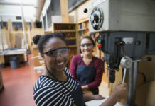 CITB aims to continue upward trend of women completing construction apprenticeships Portrait confident female high school students using drill