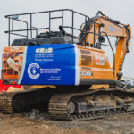 Construction partners join forces to support children’s charity CASE excavator featuring charity branding