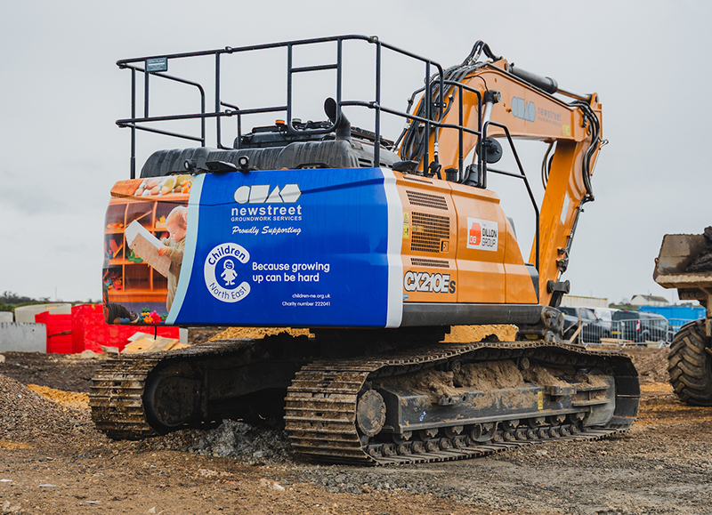 CASE excavator featuring charity branding