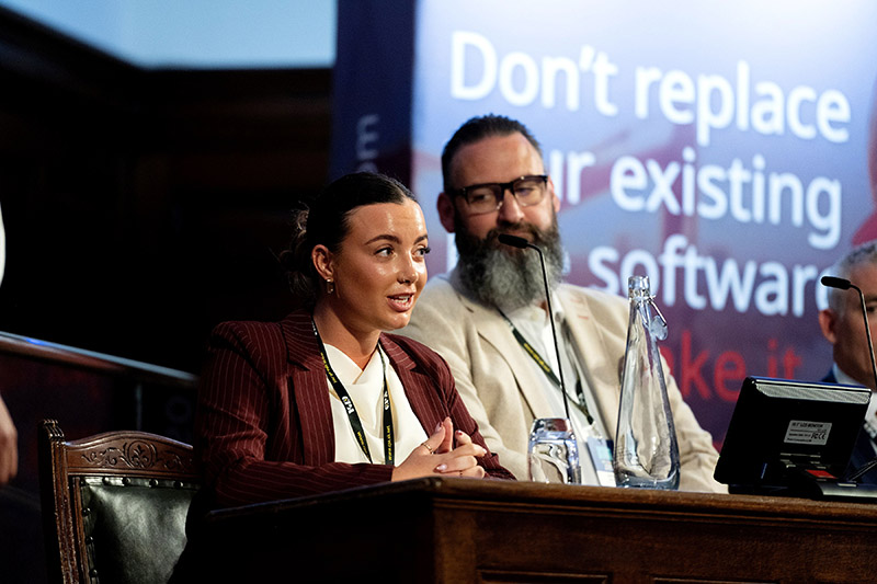 Molly Gill, plant operator, speaking at construction conference