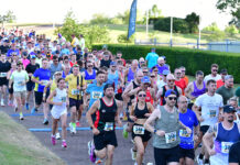 Runners beat the heat in JCB race and fun run event Runners take off at JCB event