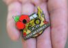 Retired firefighter digs deep for poppy appeal with JCB badge