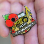 Retired firefighter digs deep for poppy appeal with JCB badge