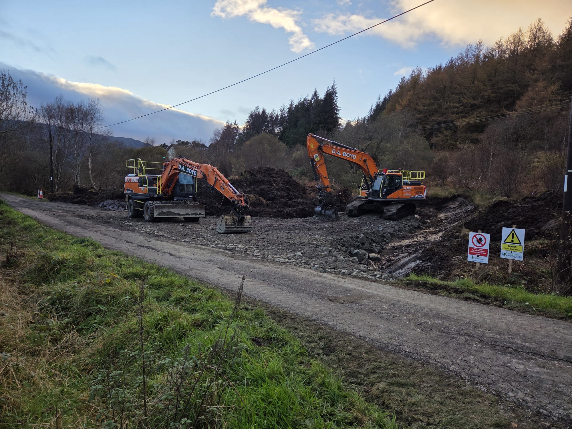 Develon excavators working on road construction