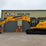 AMD snaps up first JCB 420X tracked excavator in Scotland JCB excavator outside Scot JCB's HQ with AMD livery