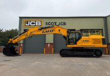 AMD snaps up first JCB 420X tracked excavator in Scotland JCB excavator outside Scot JCB's HQ with AMD livery
