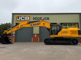 AMD snaps up first JCB 420X tracked excavator in Scotland JCB excavator outside Scot JCB's HQ with AMD livery