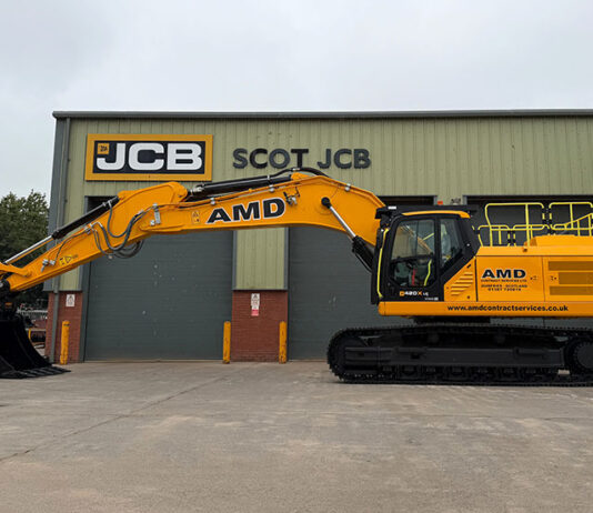 AMD snaps up first JCB 420X tracked excavator in Scotland JCB excavator outside Scot JCB's HQ with AMD livery