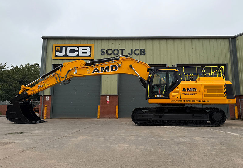 JCB excavator outside Scot JCB's HQ with AMD livery
