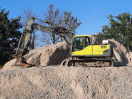 New report highlights safe digging milestone for construction sector Excavator on construction project