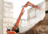 Tuff task: demolition excavator takes down historic building in Italy Building being demolished in Italy