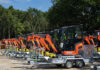 Flannery adds scores of new Kubota models to plant fleet Kubota mini-excavators lined up in a row