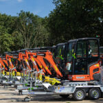 Flannery adds scores of new Kubota models to plant fleet Kubota mini-excavators lined up in a row