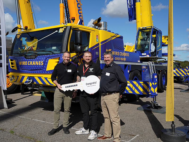 Crane handover. Lyle Sibbald (Liebherr GB); Andy Unsworth (Wire Cranes); and Richard Everist (Liebherr GB)