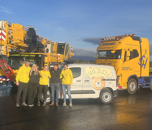 Stoddart Crane Hire helps take Sophie’s Story across the Highlands Keith Mason, Kerri MacDonald, Lizzie Mason, Ewan Stoddart and Karen Mason standing alongside the Sophie’s Story van donated by Stoddart Crane Hire