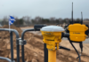 Construction tech specialist becomes member of SPOA SITECH technology on site with Scottish flag in background