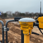 Construction tech specialist becomes member of SPOA SITECH technology on site with Scottish flag in background